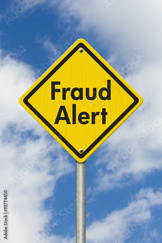 Fraud Alert yellow warning highway road sign