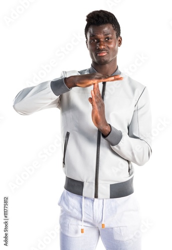 Black man making time out gesture