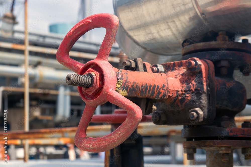 Faucet with steel pipes in natural gas processing plant in summer day Faucet with steel pipes in natural gas processing plant in summer day