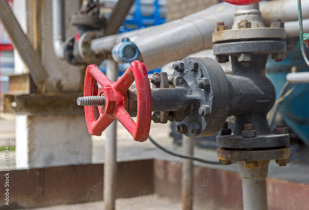 Faucet with steel pipes in natural gas processing plant in summer day Faucet with steel pipes in natural gas processing plant in summer day