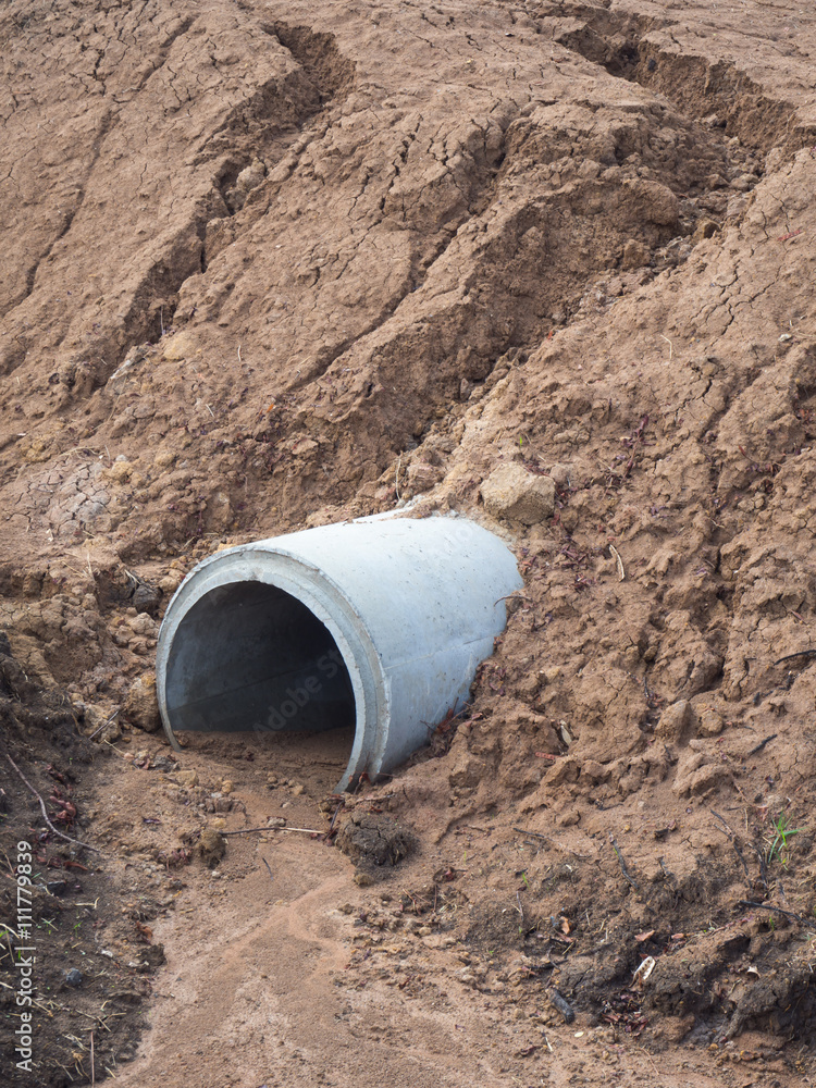 Fototapeta premium Concrete drainage pipes landfill cover soil.