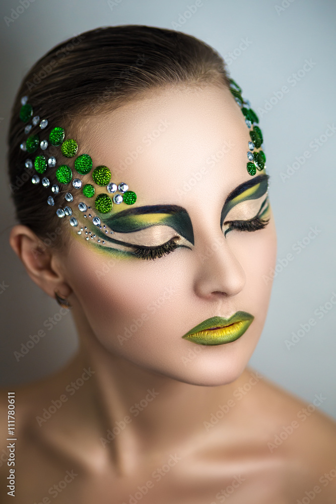 Beautiful young girl, woman, lady, predator, dragon, witch, alien, fairy  tale. Mythical, stylish look. Bright creative makeup, perfect skin,  expressive eyes, color, yellow, green, gems, crystals, art Stock Photo |  Adobe Stock