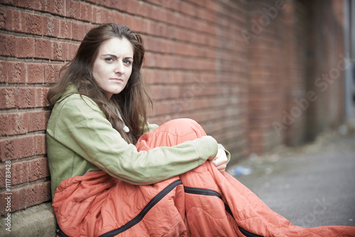 Vulnerable Teenage Girl Sleeping On The Street photo