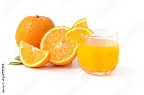 Glass of freshly pressed orange juice with sliced orange