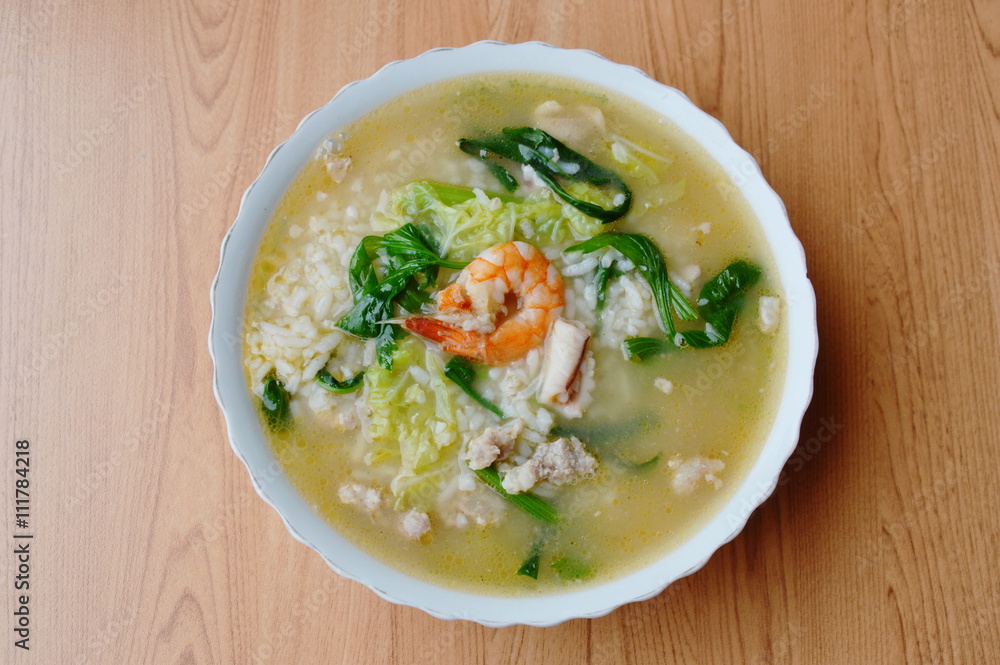 boiled rice with seafood and pork in soup on bowl boiled rice with seafood and pork in soup on bowl