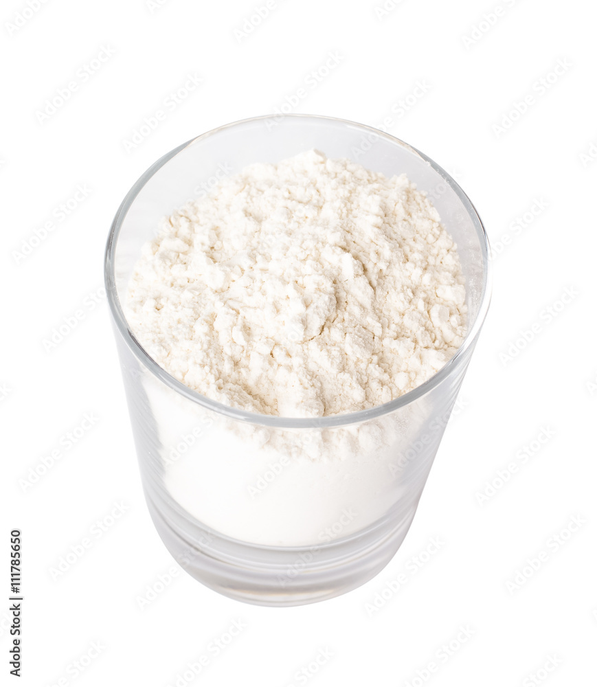 Flour in a glass on a Flour in a glass on a