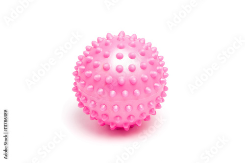 Pink spiky massage ball on white background