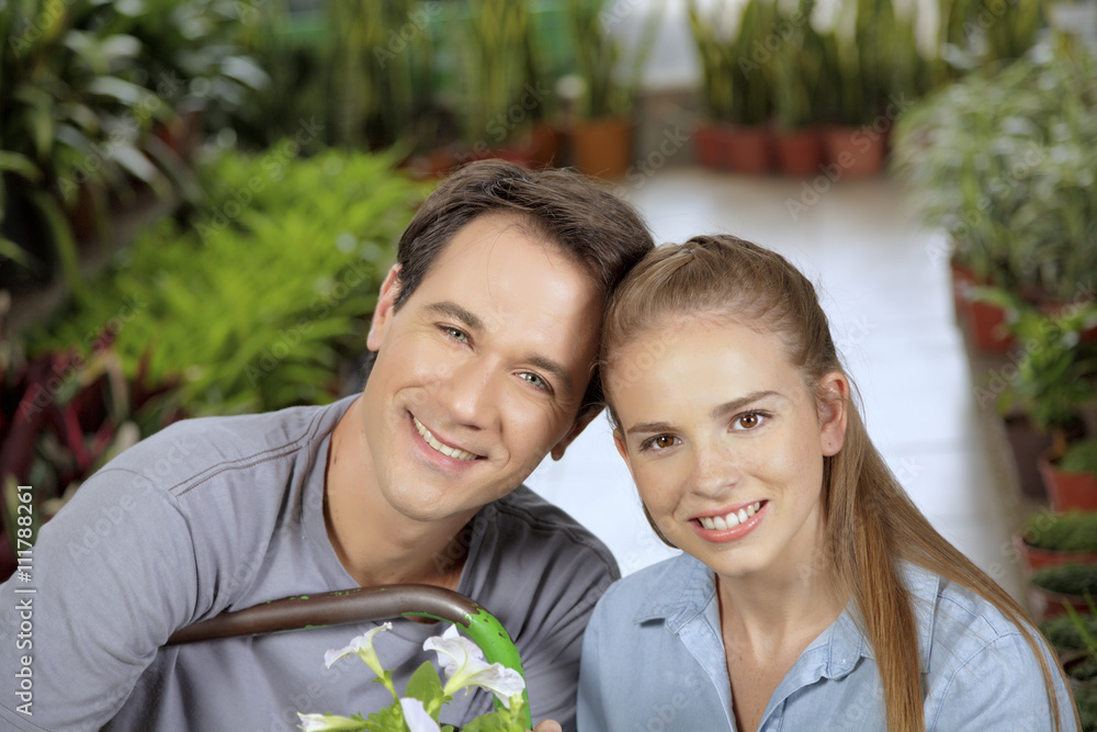 young couple shopping at a garden center young couple shopping at a garden center