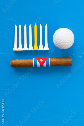 Detail of luxury Cuban cigars and golf equipments