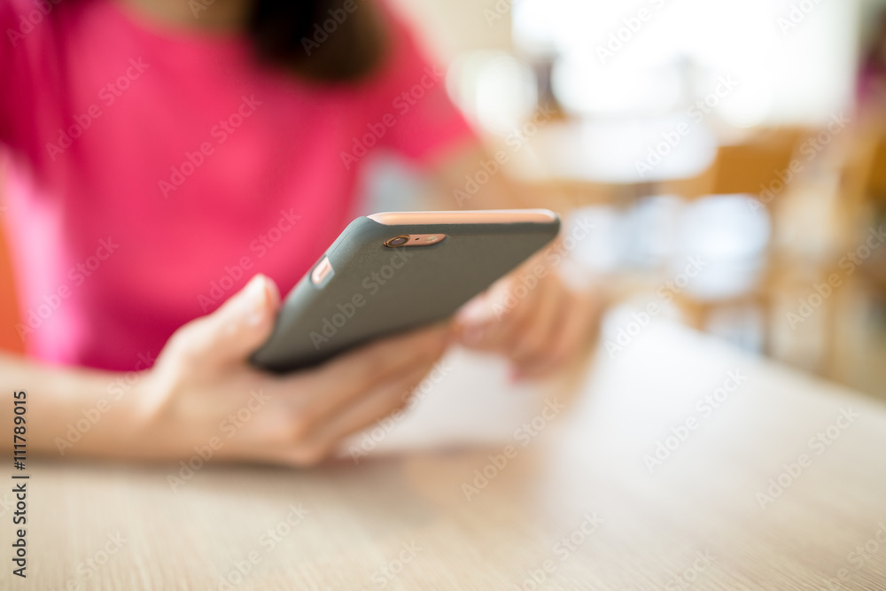 Woman use of cellphone at cafe Woman use of cellphone at cafe