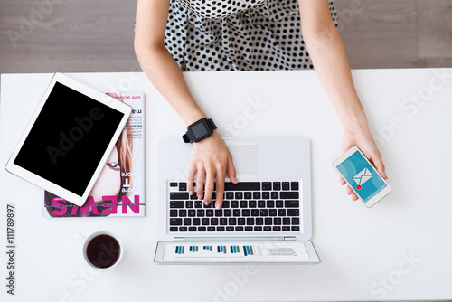 Nice woman working at the table 