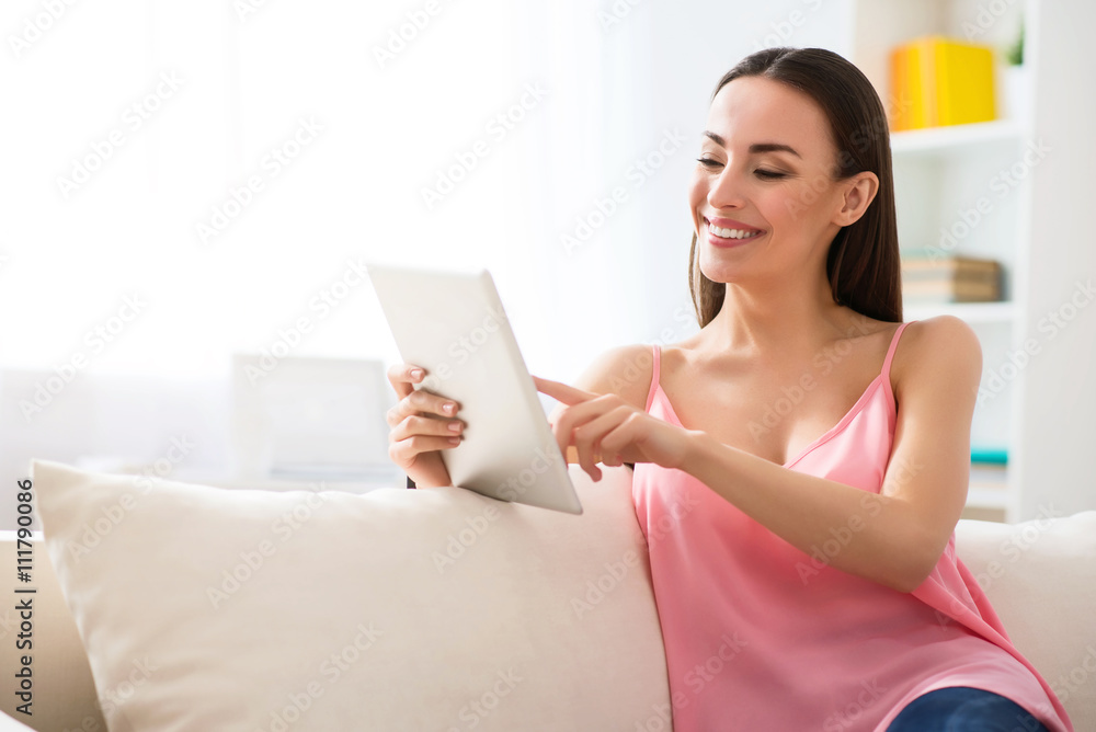Pleasant beautiful woman resting on the couch Pleasant beautiful woman resting on the couch