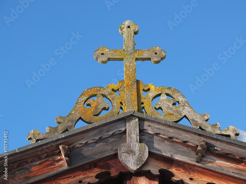 Old wooden Cross on Roof