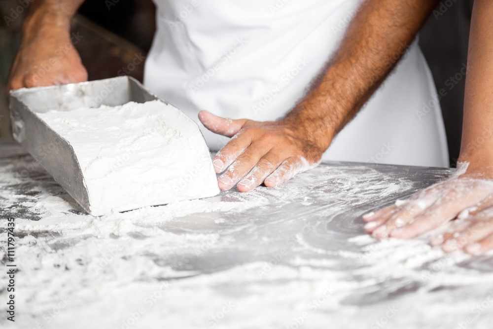 Baker's Hands With Flour On Table At Bakery Baker's Hands With Flour On Table At Bakery