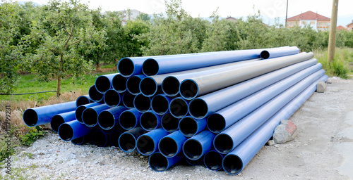 pile of blue pvc pipe
