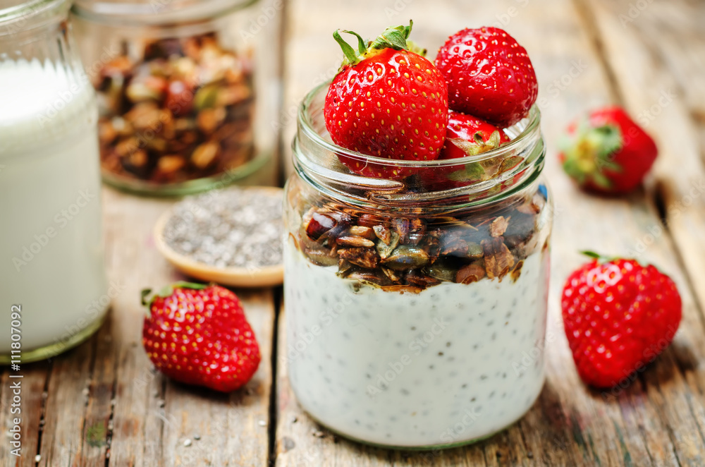 Chia seeds granola Greek yoghurt pudding with strawberries Chia seeds granola Greek yoghurt pudding with strawberries