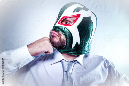 Office, angry businessman with Mexican wrestler mask, expression photo