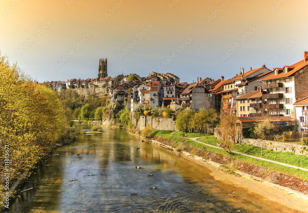 Cathedral of St. Nicholas and Sarine river in Fribourg, Switzerland Cathedral of St. Nicholas and Sarine river in Fribourg, Switzerland