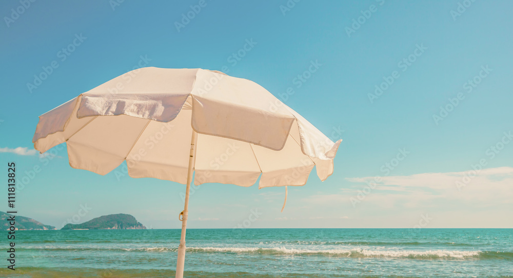 Umbrella on tropical beach hot summer day
