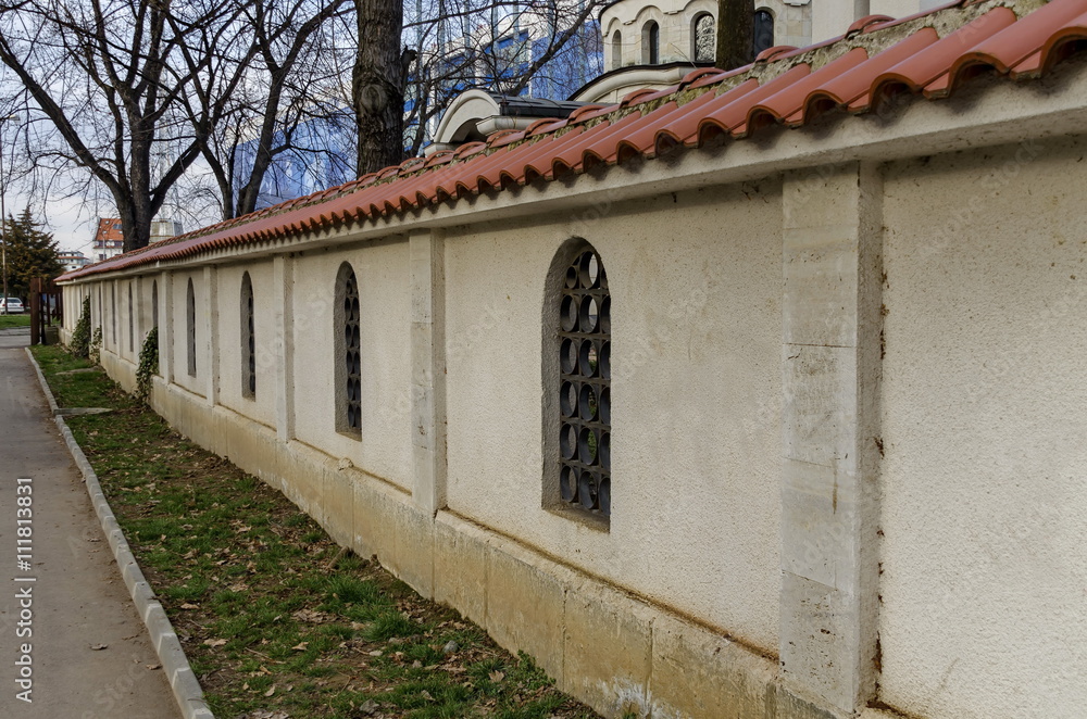 Stone wall covered with tile and window in Sofia, Bulgaria