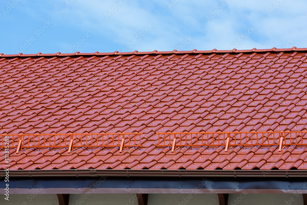 Naklejka premium modern roof of glazed ceramic tiles.