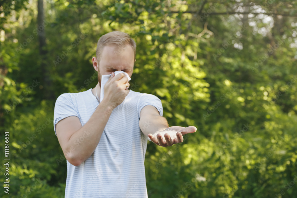 young man suffering spring pollen allergy young man suffering spring pollen allergy