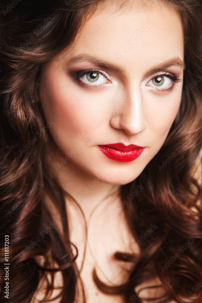 Close-up portrait of beautiful brunette young woman in elegant luxury red dress Close-up portrait of beautiful brunette young woman in elegant luxury red dress