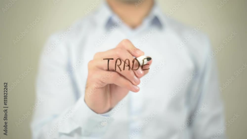 Trade Sanctions, man writing on transparent screen Trade Sanctions, man writing on transparent screen