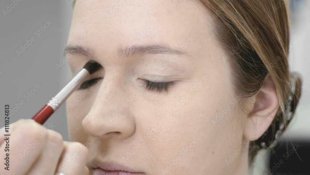 The visage master making make-up for young model The visage master making make-up for young model