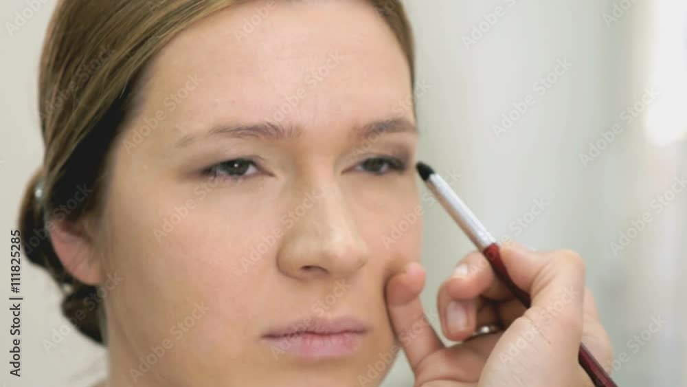 The visage master making make-up for young model The visage master making make-up for young model