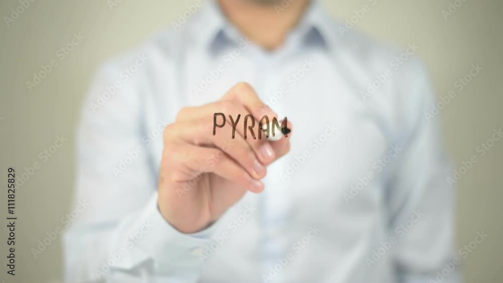 pyramid Scheme , man writing on transparent screen pyramid Scheme , man writing on transparent screen