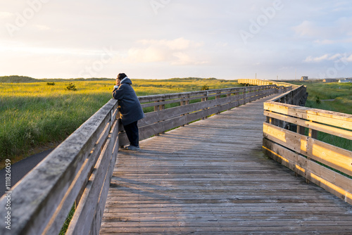 Fototapeta Naklejka Na Ścianę i Meble -  Woman Taking Walk At The Beach