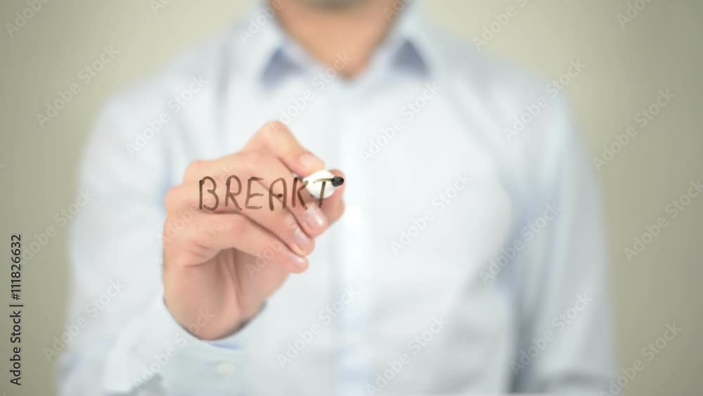 Breakthrough , man writing on transparent screen Breakthrough , man writing on transparent screen