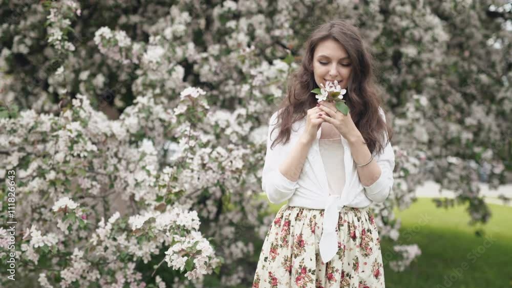 Beautiful natural woman in the garden of apple Beautiful natural woman in the garden of apple