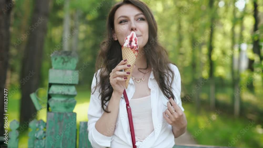 Portrait of young happy woman eating ice-cream, outdoor Portrait of young happy woman eating ice-cream, outdoor