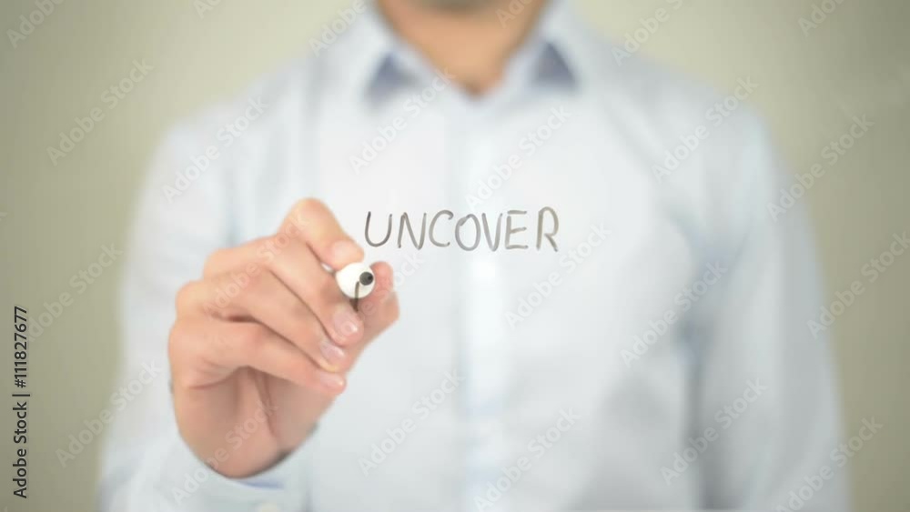 Uncover The Facts , man writing on transparent screen Uncover The Facts , man writing on transparent screen