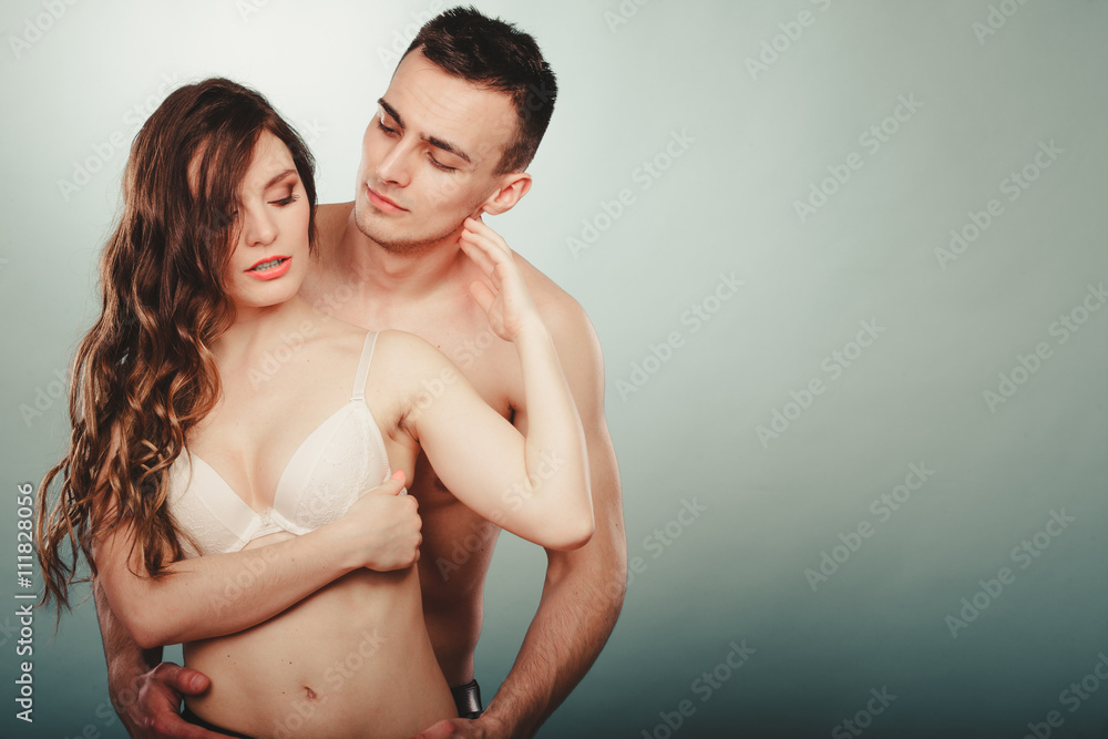 Naklejka premium Sexy couple. Half naked man and woman in lingerie.