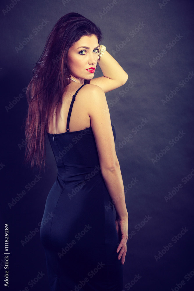 woman in sensual black dress on dark woman in sensual black dress on dark