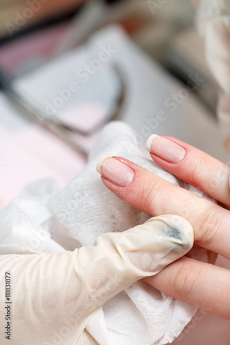 Manicure. Removing cuticle.