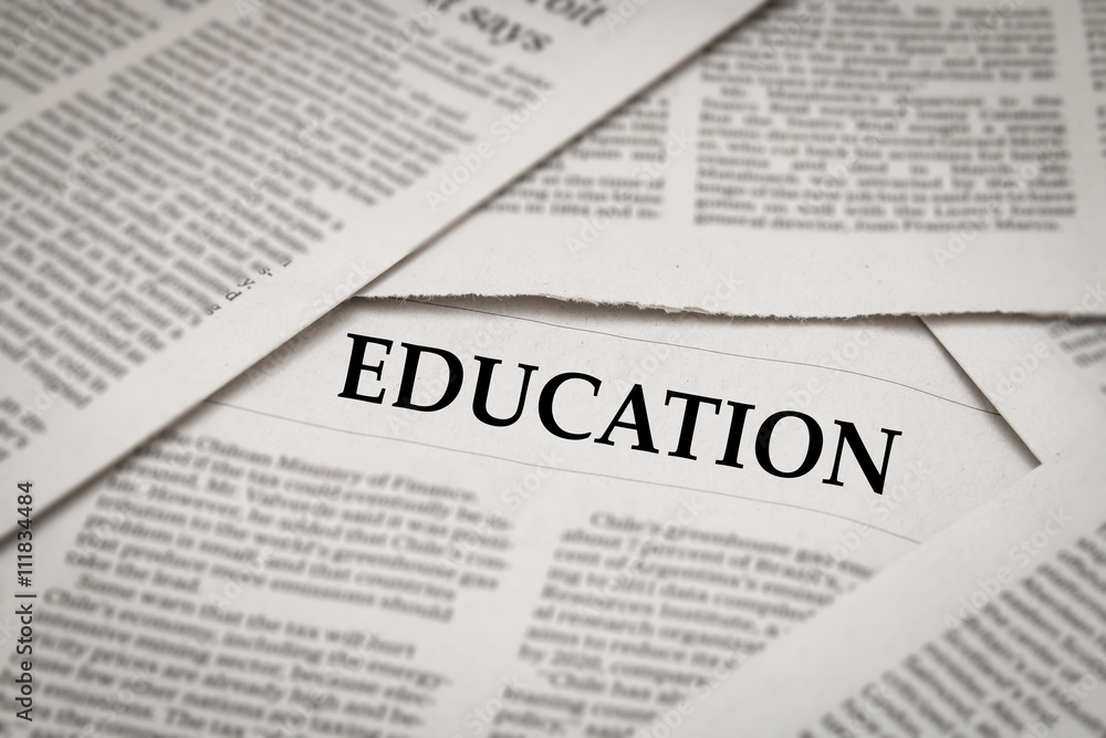 Obraz premium education headline on newspaper
