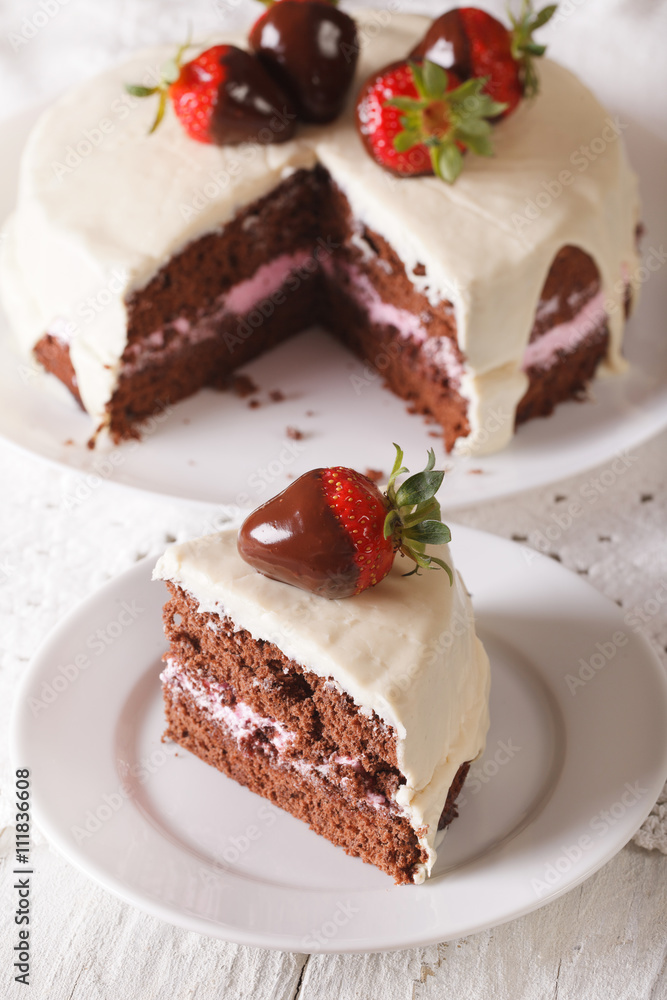Cut a piece of cake with dark and white chocolate and strawberry. vertical
Cut a piece of cake with dark and white chocolate and strawberry. vertical