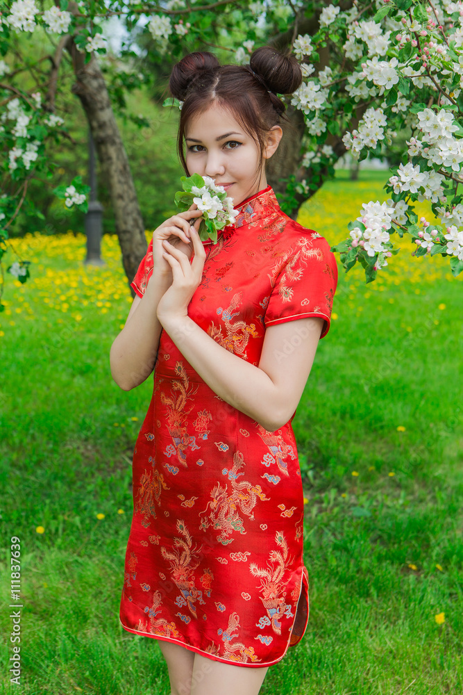 Beautiful asian girl in traditional chinese red dress. Beautiful asian girl in traditional chinese red dress.