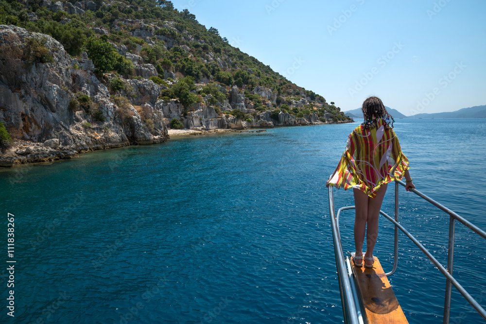 girl standing at the bow yacht