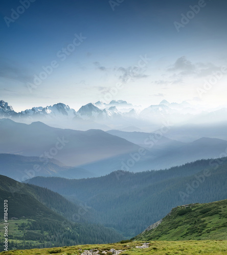 Hills during sunrise in mountain valley. Beautisul natural landscape