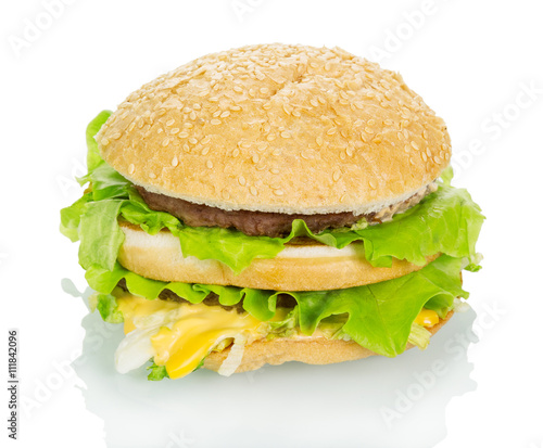 Big hamburger closeup isolated on white.