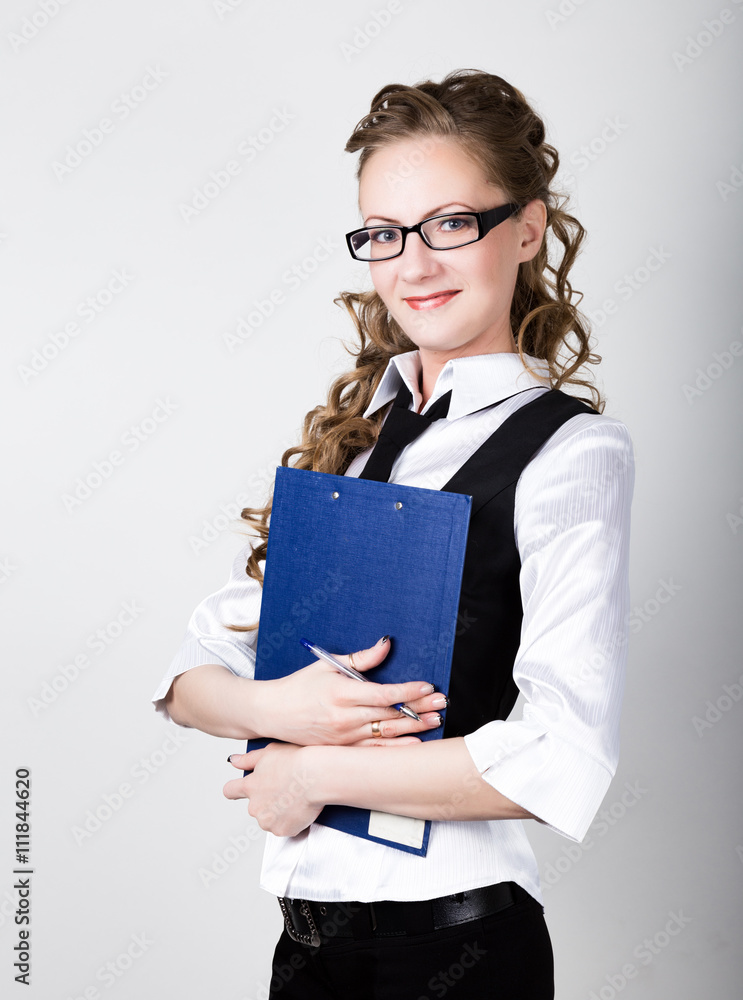Successful business woman in a business suit and glasses holding folder Successful business woman in a business suit and glasses holding folder