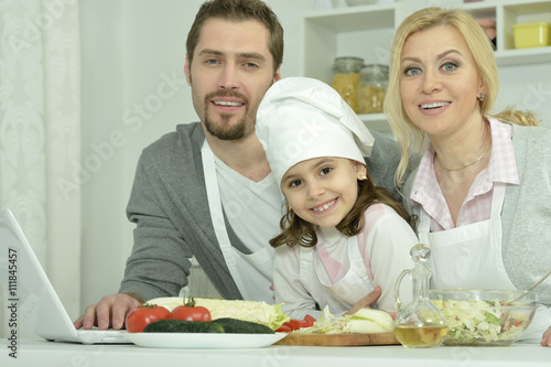 happy family cooking  in kitchen
