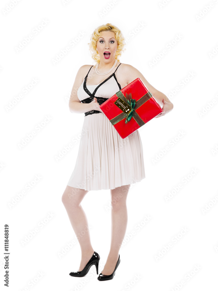 woman holding a gift box with mouth open. woman holding a gift box with mouth open.
