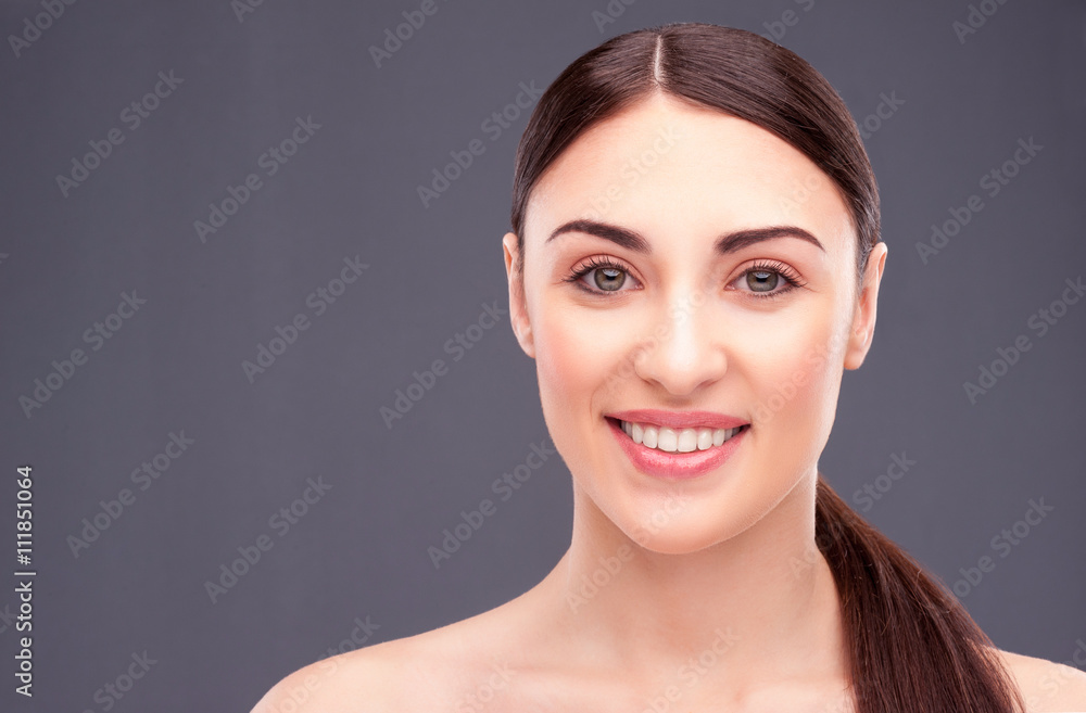 Attractive brunette girl is caring of skin Attractive brunette girl is caring of skin