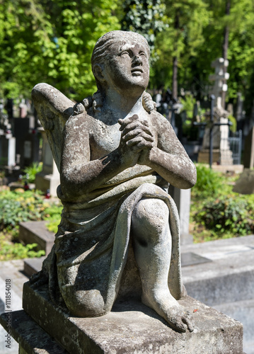 Old statue on grave
